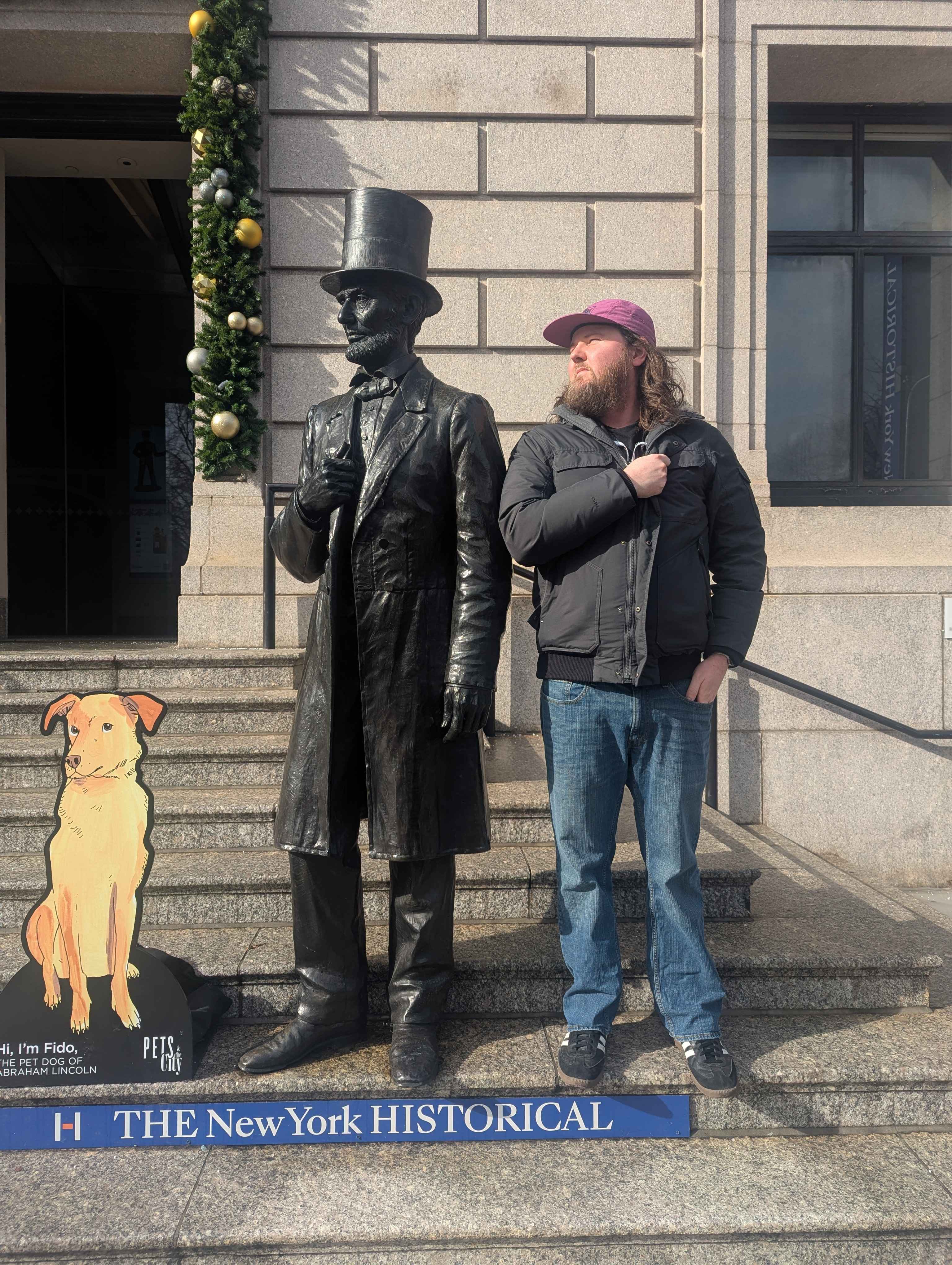 Jacob posing with Lincoln outside the museum.