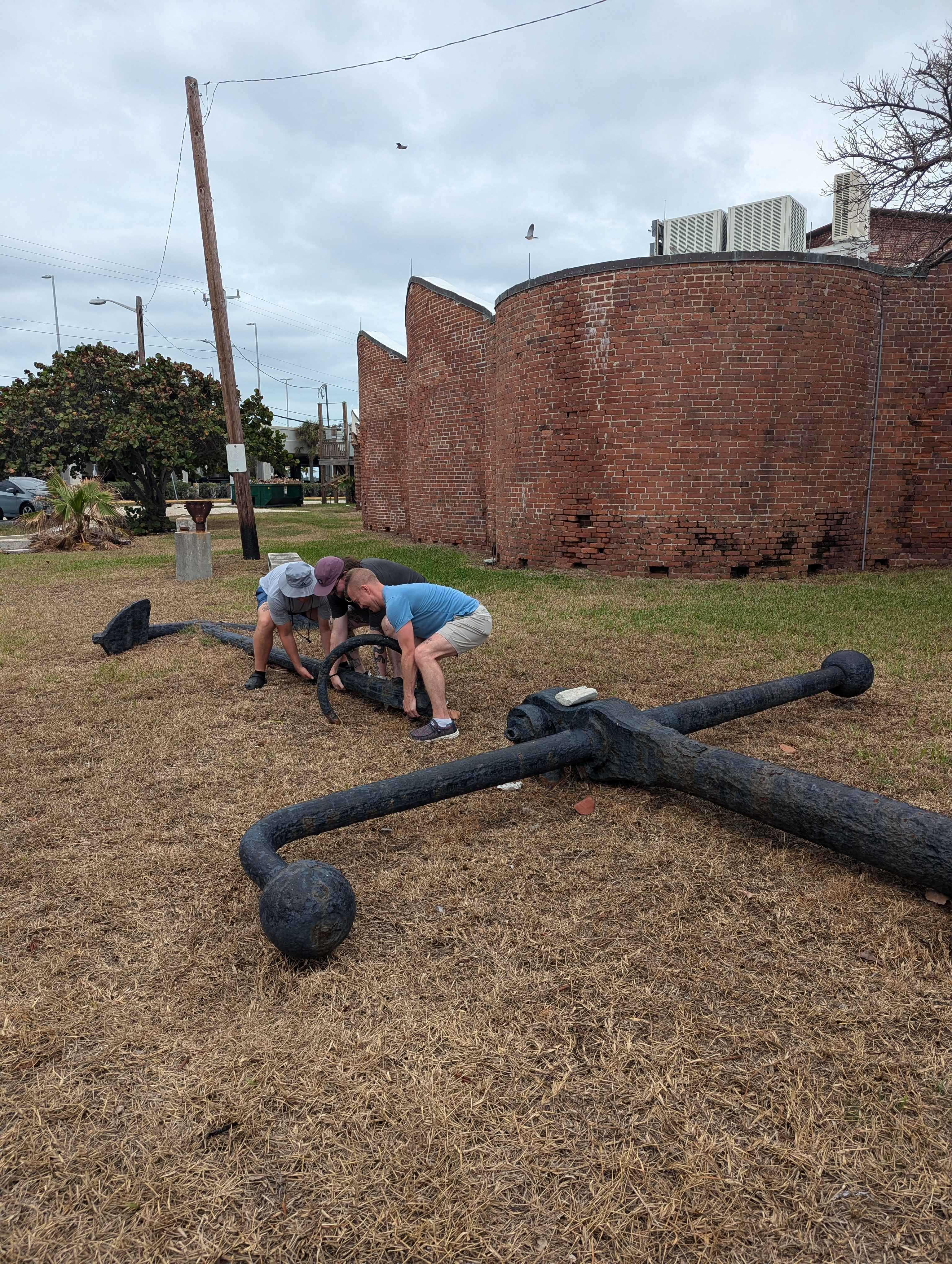Outside the Fort Martello Museum, the boys had to try and pick up the anchor