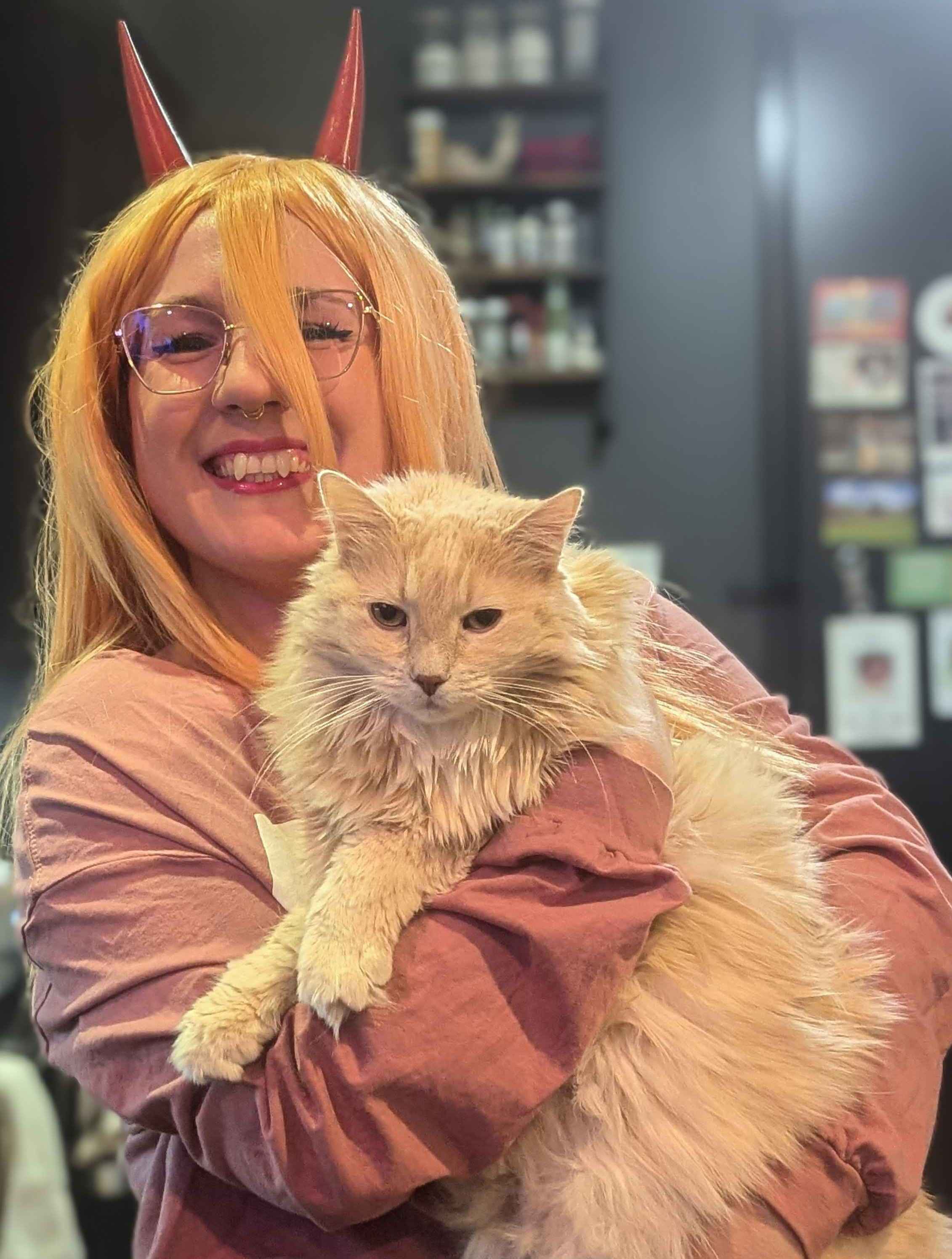 Jen dressed as Power, with her pet cat.