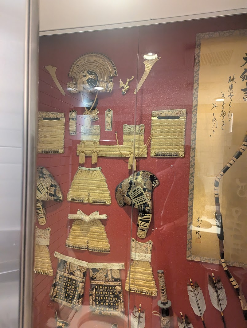 The bathrooms at Ippudo have samurai armor in the bathroom.