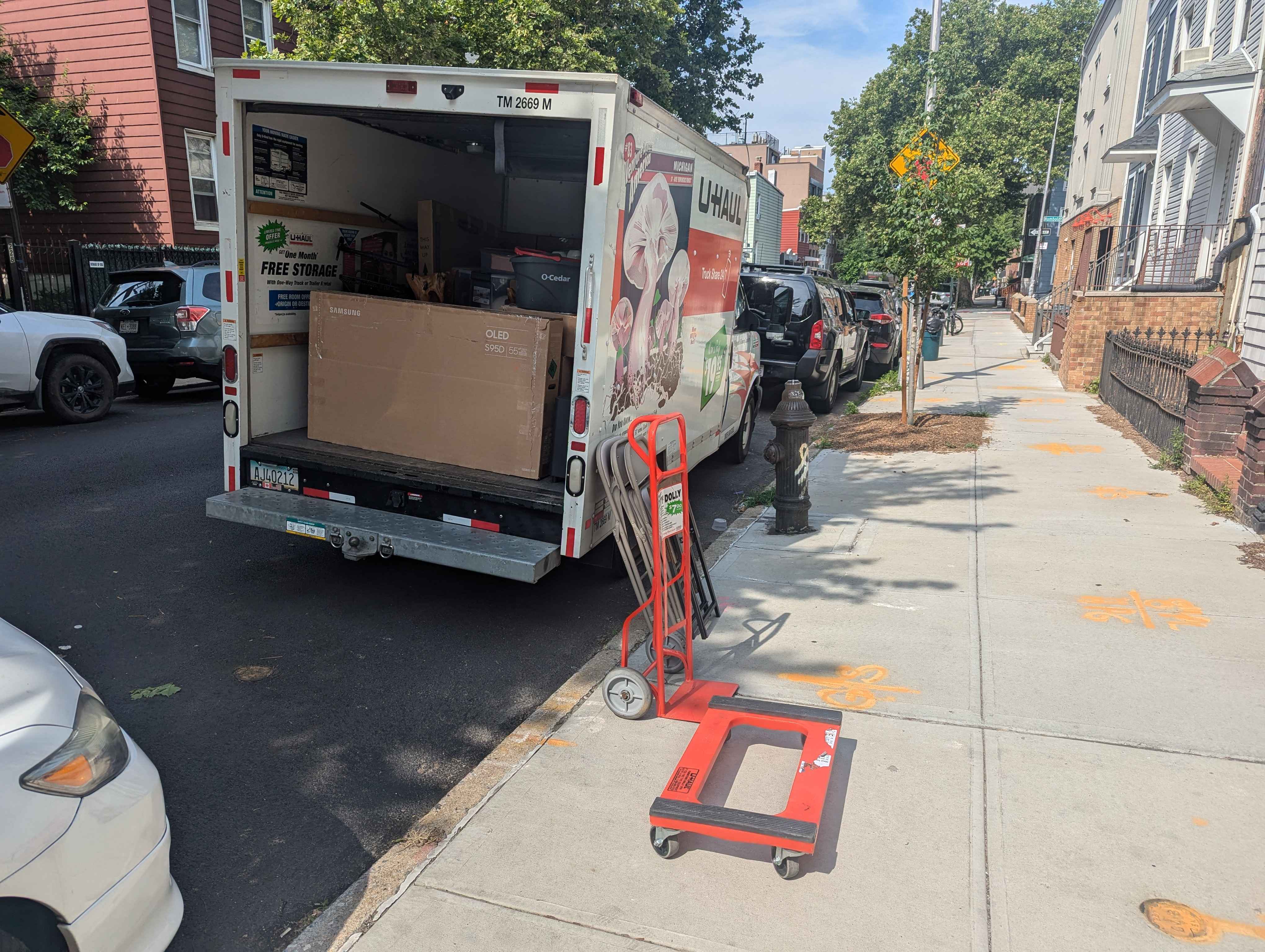 UHaul truck on the street in front of our apartment.