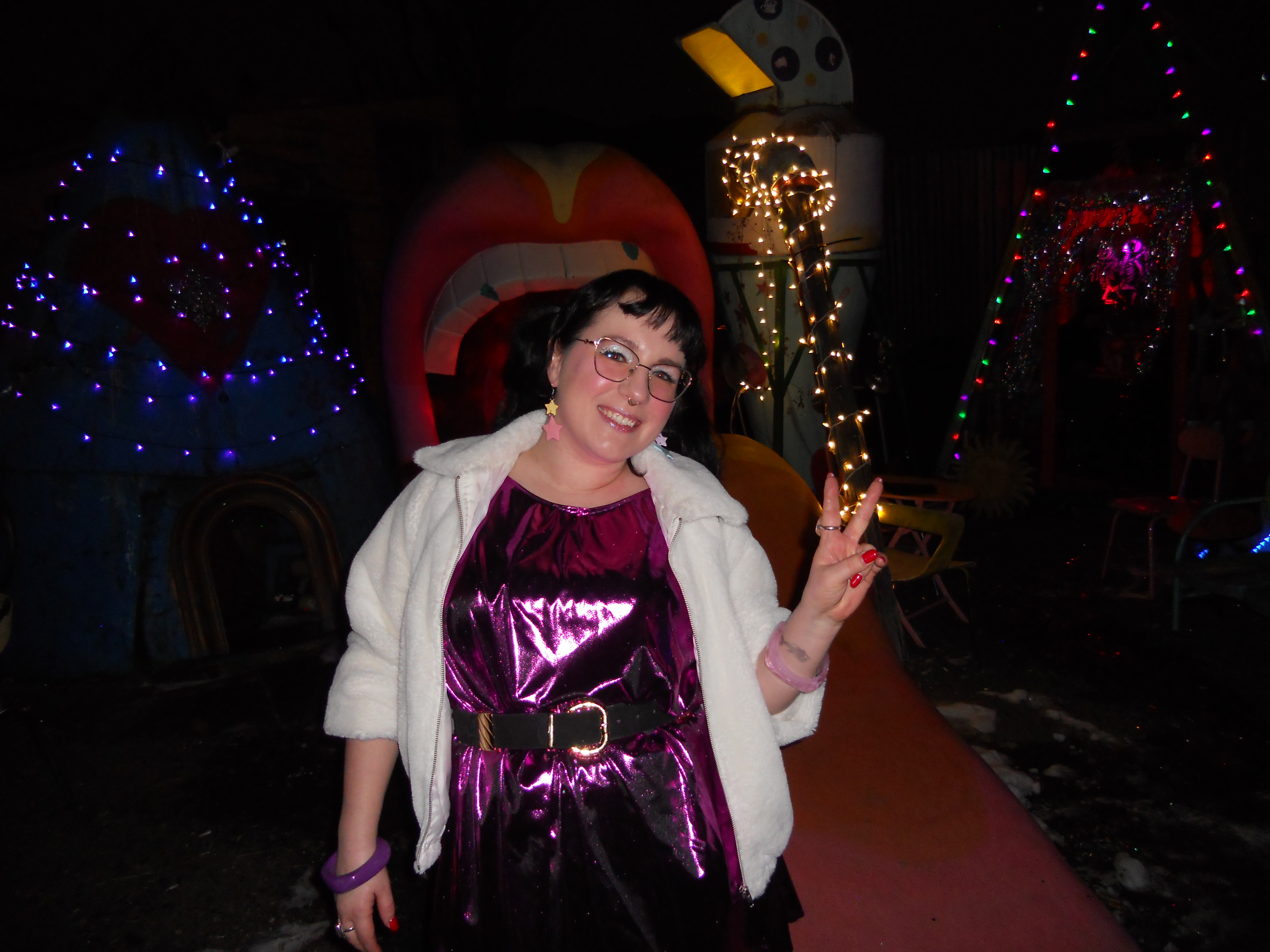 Jen in front of one of the other decorations, a giant mouth and tongue.