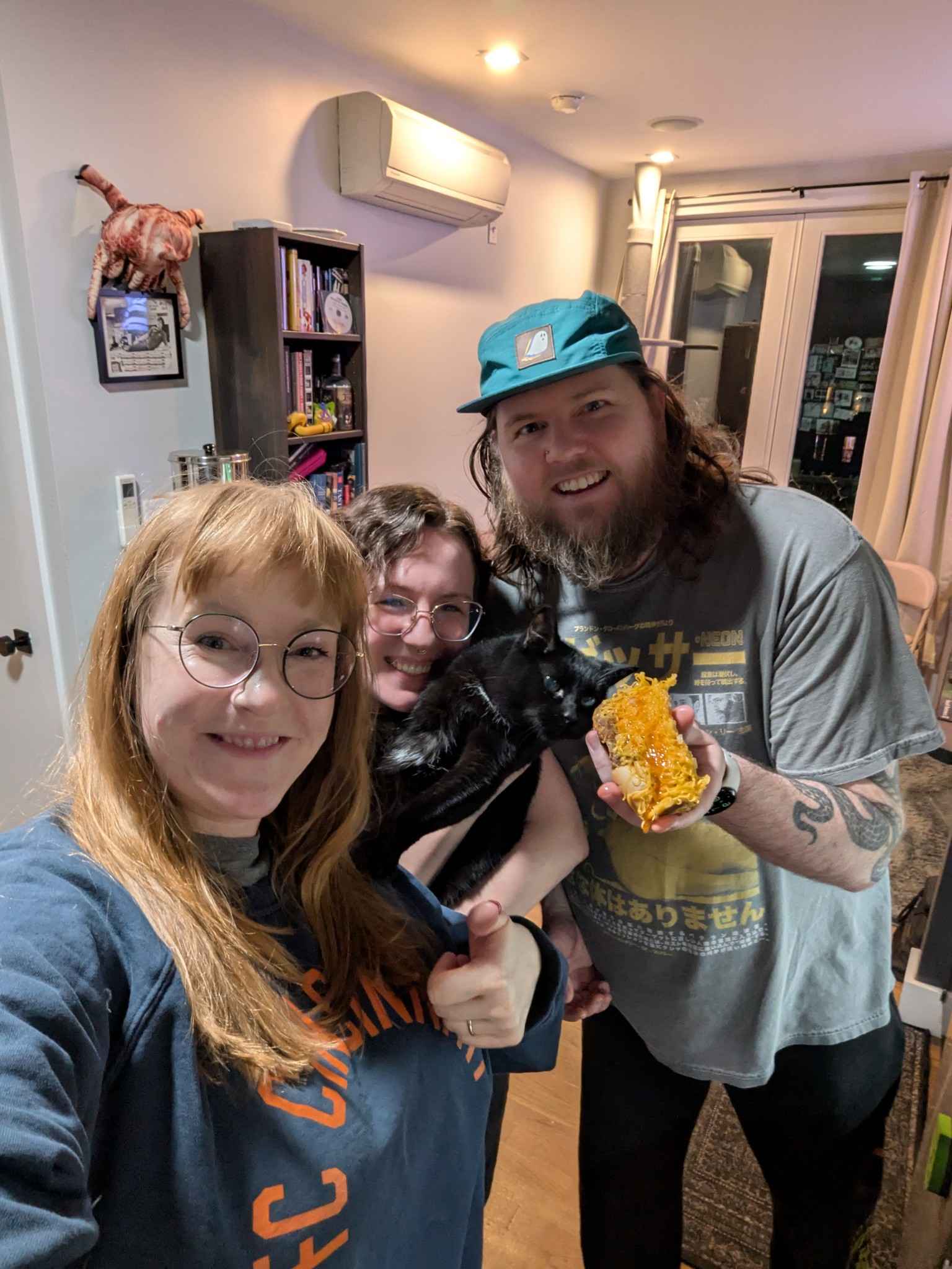 Posing with the cheese coney that traveled all the way from Cincy. Molly really wants to take a bite!