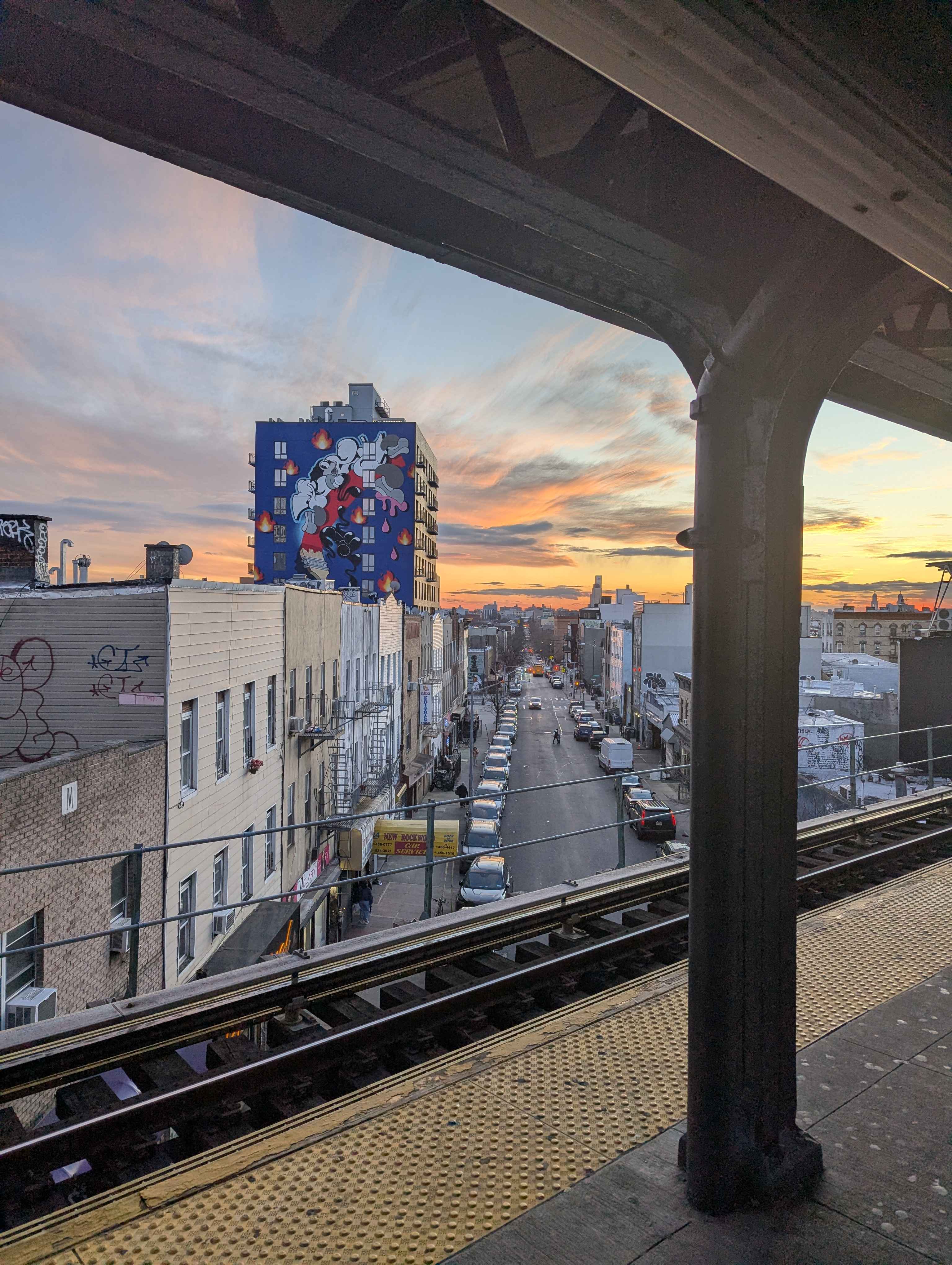 A nice view of the city from an elevated train platform.