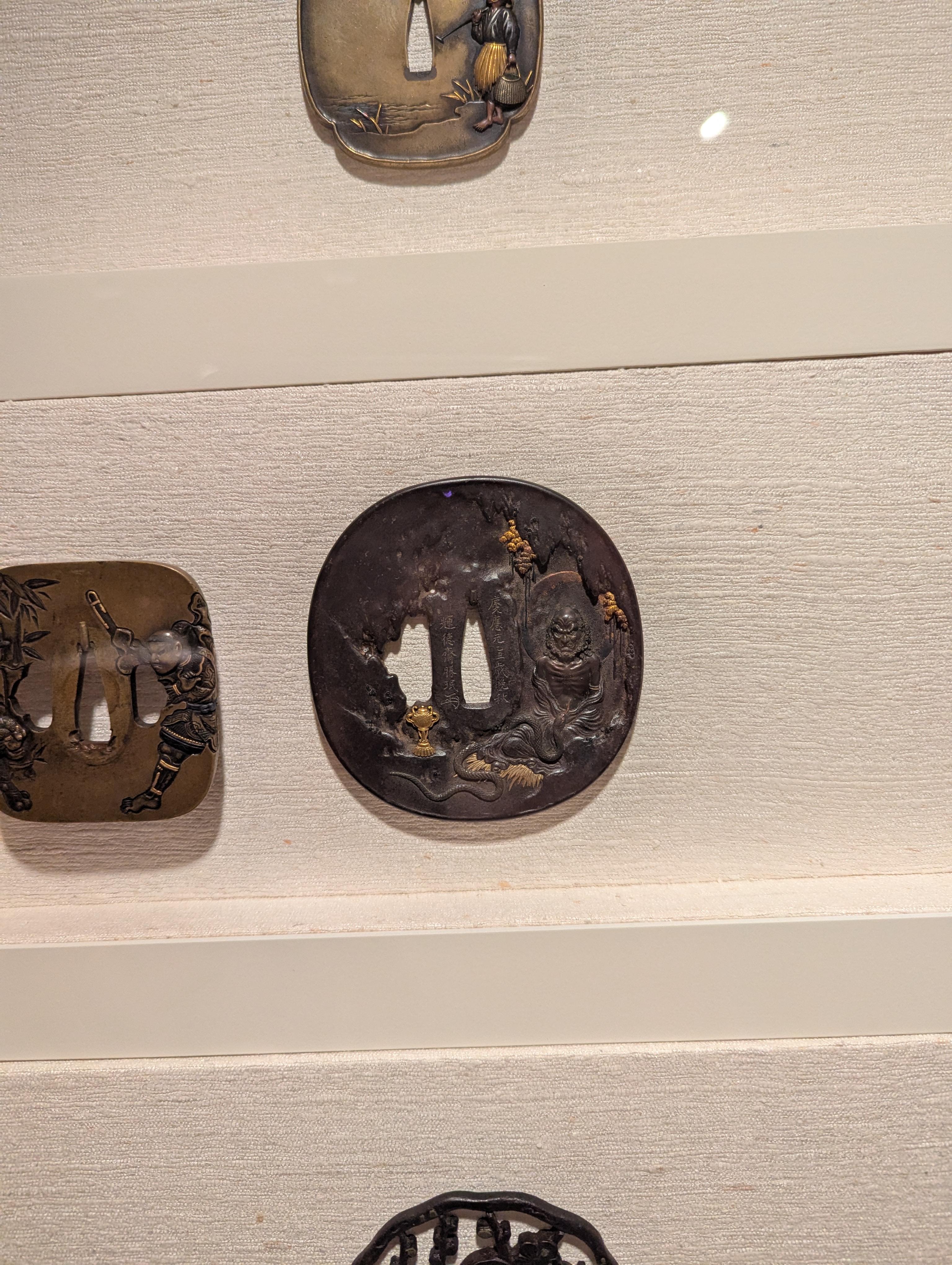 Decorative pieces that would sit on the hilt of a swordd. These are Japanese. They were both functional and decorative.