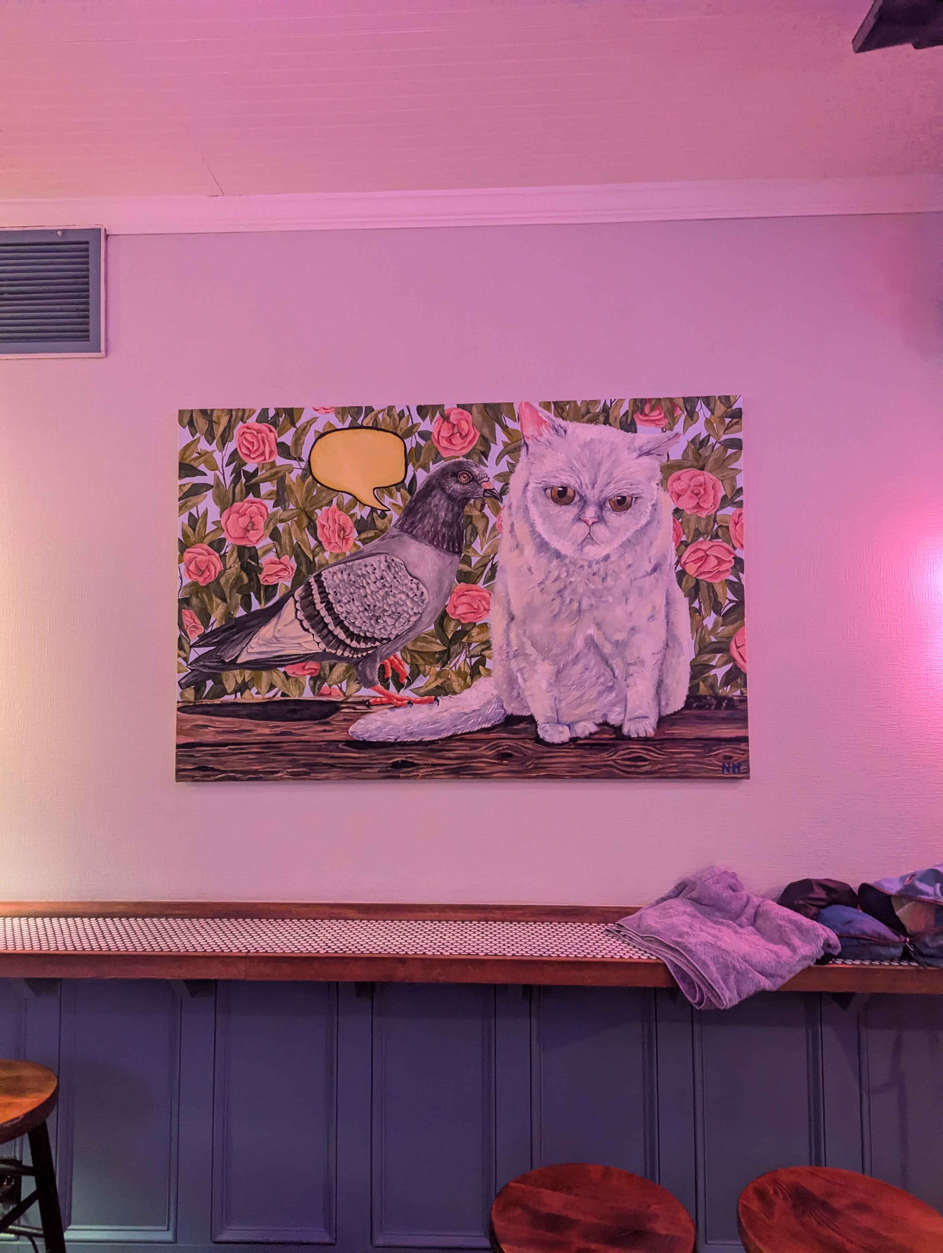 A fun painintg of a cat and a pigeon we saw at a bar called Blinkys.